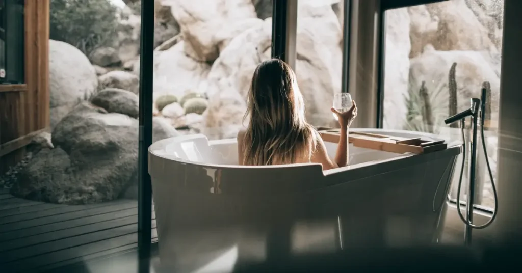 Light Feminine Energy: 7 Tips to Embrace Your Inner Strength 10 woman in light feminine energy in bathtub