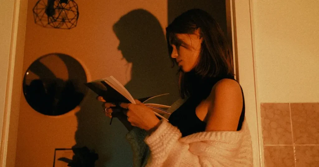 Best 12 Dark Feminine Energy Books To Unleash Your Power 6 woman reading dark feminine energy book