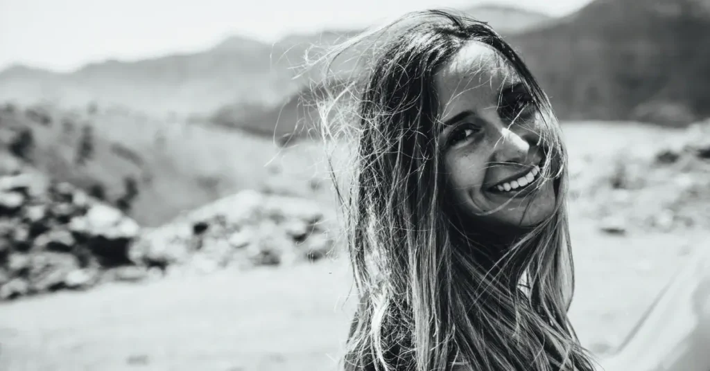 Light Feminine Energy: 7 Tips to Embrace Your Inner Strength 9 smiling woman with light feminine energy