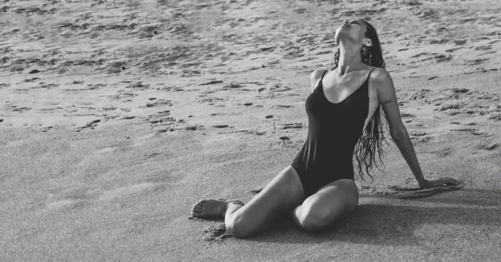 Light Feminine Energy: 7 Tips to Embrace Your Inner Strength 13 woman at the beach with light feminine energy